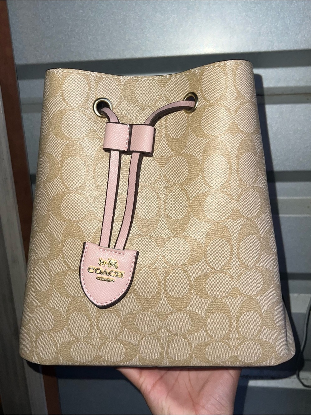 Coach Beige Signature Canvas Crossbody Bucket Bag with Pink Trim